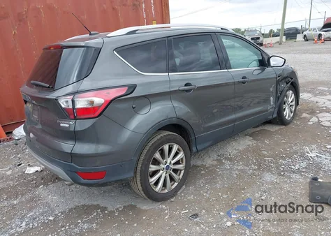 2017 Ford Escape Titanium z USA, uszkodzony, nr VIN 1FMCU0J93HUB62140
